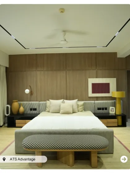 This is what I call a master suite. From the custom wood-paneled feature wall and integrated bedside lighting to the plush, comfortable furnishings, every detail in this penthouse bedroom is crafted for ultimate relaxation and style.