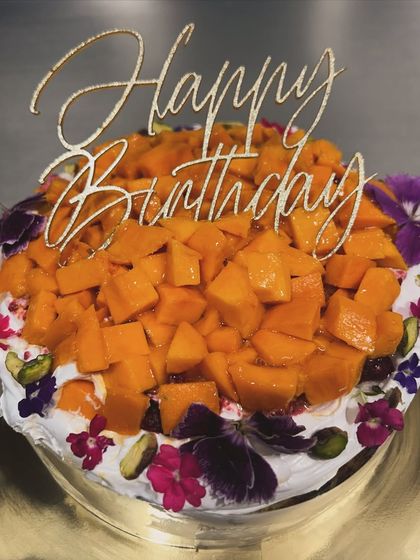 My signature Basque burnt cheesecake gets a seasonal upgrade. It's topped with fresh cream, sweet organic Alphonso mangoes, and delicate edible flowers.