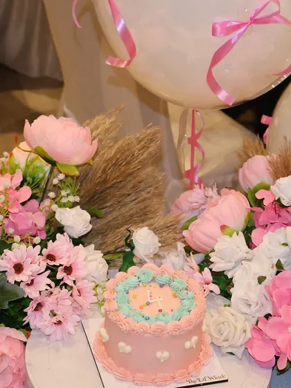 Another view of our fourth anniversary cake, surrounded by beautiful flowers. We are so thankful for everyone who has been a part of our journey.