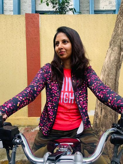 A graduate enjoying a moment on her bike. The confidence and joy she radiates are the goals of our training program.