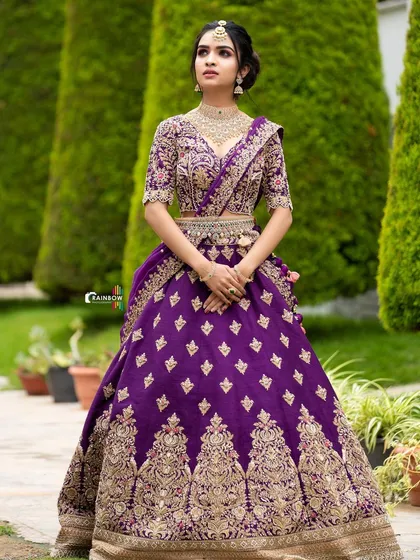 My artistry extends to modern reception styles too. This glamorous look features a bold purple lehenga, complemented by a sophisticated makeup style and diamond jewellery for a truly show-stopping effect.