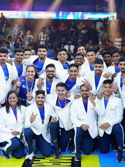A snapshot of the winning squad. The smiles and victory signs represent countless hours of hard work, strategic planning, and unwavering team spirit.