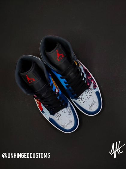 A top-down view of the custom Luffy Gear 4 Jordan Mids. The design covers the entire shoe, including the toe box which features Japanese sound effects from the manga.