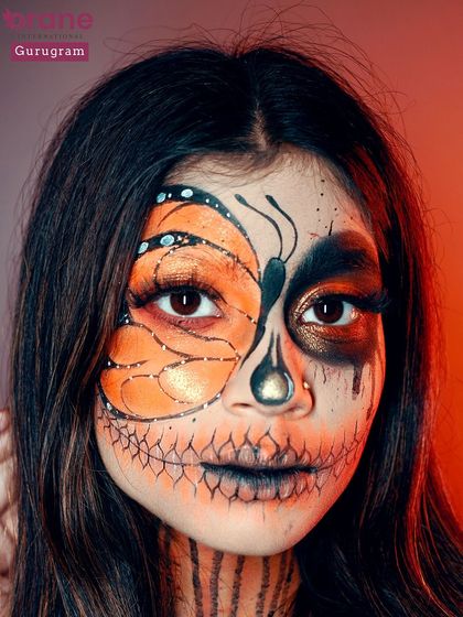 A direct look at the butterfly skull makeup, showing the incredible detail and symmetry required. This is a true test of an artist's skill and creativity.