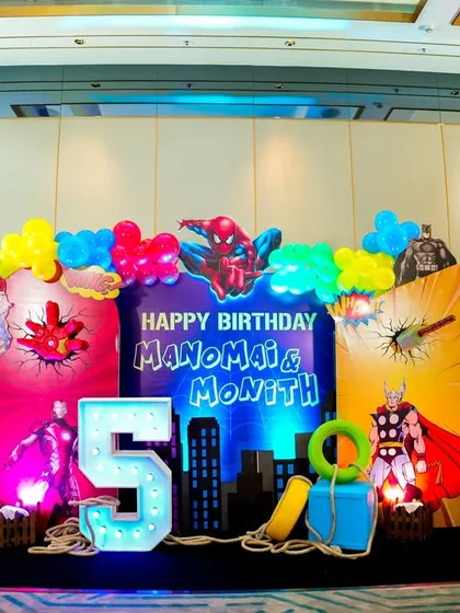Your child's favorite heroes, brought to life. This vibrant Superhero-themed stage setup for a 5th birthday is a great example of our detailed, multi-character backdrops, complete with custom lighting and props that make for epic photos.