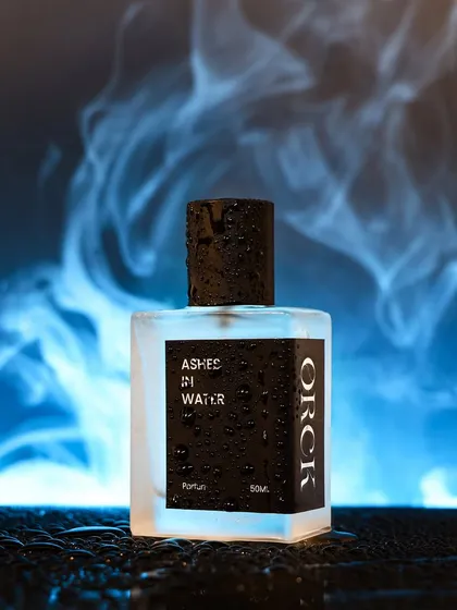I love creating a mood. For this perfume, 'Ashes in Water', I used smoke and dramatic lighting to evoke a sense of mystery and luxury. This is a high concept product shot that tells a story and makes the fragrance unforgettable.