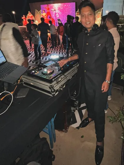 Dressed in a classic black sherwani for a Sangeet night. I always make sure to dress appropriately for the occasion, respecting the event's theme.