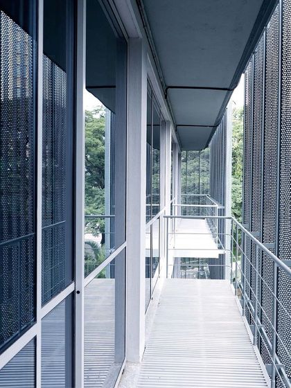 The balconies of ICP Brunton Central, an adaptive reuse project. The new perforated metal skin and walkways were added to an existing 1980s building, transforming it into a modern, sustainable commercial property with a new relationship to the outdoors.