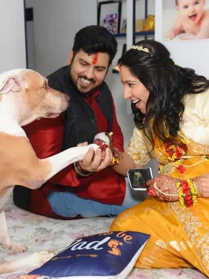 A heartwarming and candid moment as the family dog gives a paw-shake to the parents-to-be at their baby shower. I always look for these unique, personal interactions that make your event story truly yours.