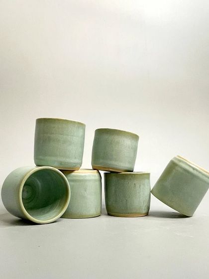 Another arrangement of the seafoam green tumblers. The organic feel and subtle imperfections add character, making each tumbler truly one-of-a-kind.