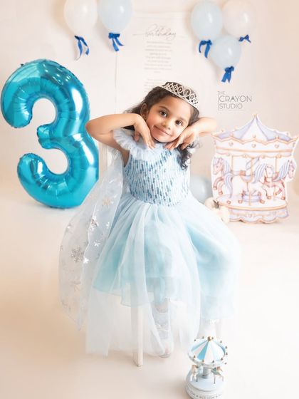 A cute and sassy pose from the birthday girl, framing her face with her hands. Her personality shines in this shot.