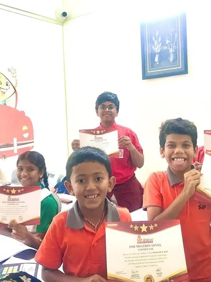 More happy faces with their Foundation Level certificates. This level builds the core understanding of abacus and mental math, and these students have mastered it.