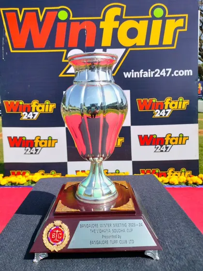 The Vidhana Soudha Cup, a beautiful silver and red trophy.