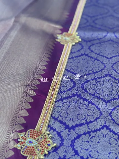 A detail of the embroidered waist belt designed to match this purple and gold half-saree set.