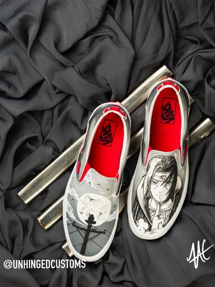 Another Itachi masterpiece, this time on a pair of Vans Slip-Ons. The grayscale artwork with a pop of red in the lining creates a super clean and impactful design.