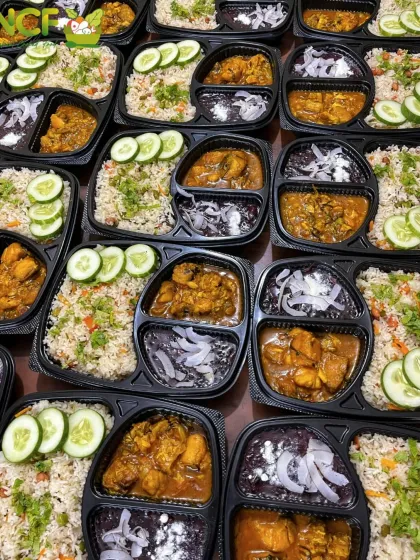 Another angle of our popular veg pulao and fish curry meal boxes, showing the fresh cucumber garnish.
