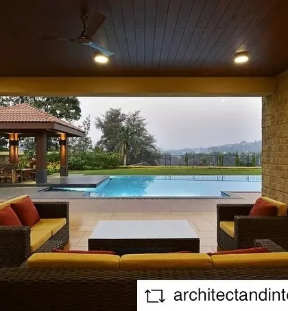 The veranda of the Khandala villa overlooks the pool and gazebo. This indoor-outdoor space is perfect for relaxing and enjoying the stunning views of the surrounding landscape.