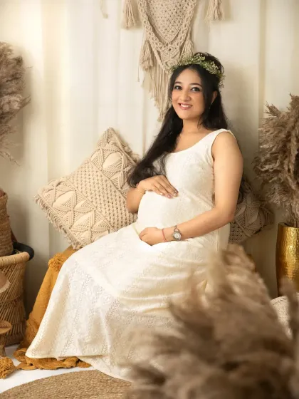 The pure joy of anticipation. This mother's radiant smile says it all. My goal is to make you feel comfortable and beautiful, so we can capture genuine moments of happiness like this one in my cozy Bhubaneswar studio.