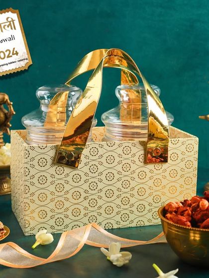 An elegant, traditionally patterned two-jar caddy, showcasing the variety of our custom hamper options for Diwali.