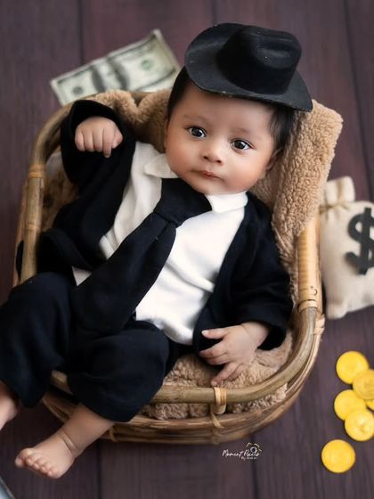 The littlest boss with the biggest deals. This fun 'money boss' themed newborn shoot was a creative way to capture a powerful personality in a tiny package.