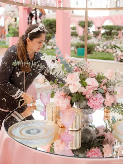 A behind-the-scenes moment of me adding the final touches to a tablescape in Doha. A wedding set is the calm after the storm of planning and execution, and seeing it all come together is the most rewarding part of my job.