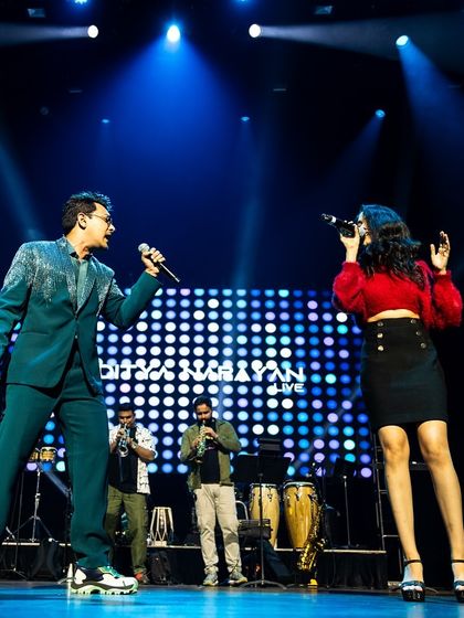 A wide shot of the stage with Aditya Narayan in Vancouver. This shows the scale of the full band setup for a major concert.