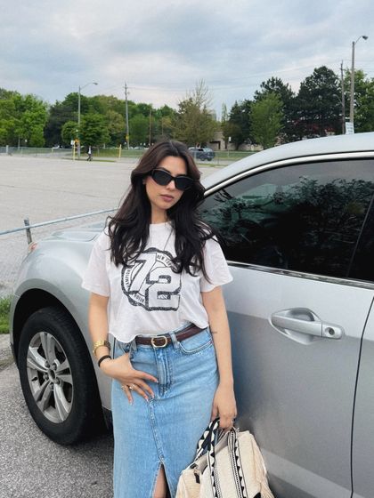 A casual OOTD shot in a parking lot after a shopping trip.