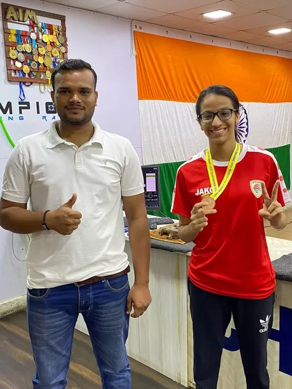 Veyanka and Coach Aaditya Rastogi celebrating her bronze medal win at the range. Every medal is a team victory.