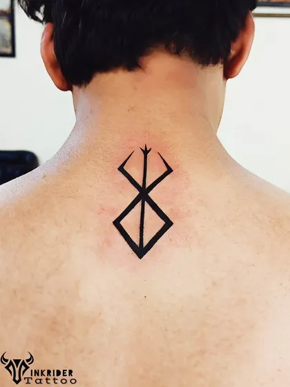 For fans of the manga "Berserk," we inked the iconic Brand of Sacrifice symbol. It’s a bold, solid black piece that represents struggle and survival.