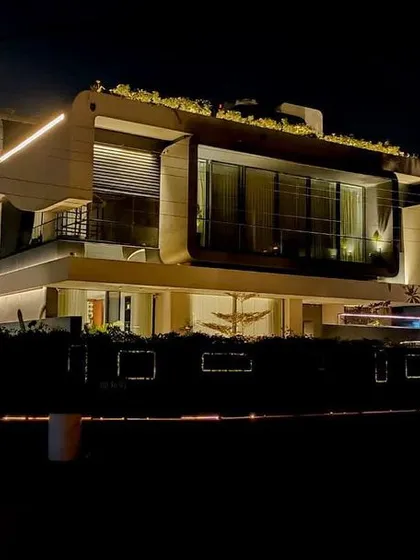 For this modern home in Panchkula, the goal was to create a striking nighttime identity. We used continuous linear profile lights to trace the building's bold geometric forms, making the structure a landmark in its environment.