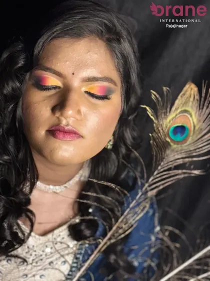 Another angle of the Haldi look, showing the beautiful blend of orange, yellow, and pink on the eyes.