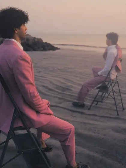 Two figures, one story. This shot from the silhouette series uses the beach at dusk to create a moody, introspective narrative, where the sharp tailoring and clean hair stand out.
