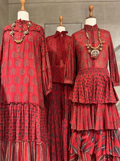 Another view of the red printed collection, showcasing tiered skirts and various necklines.