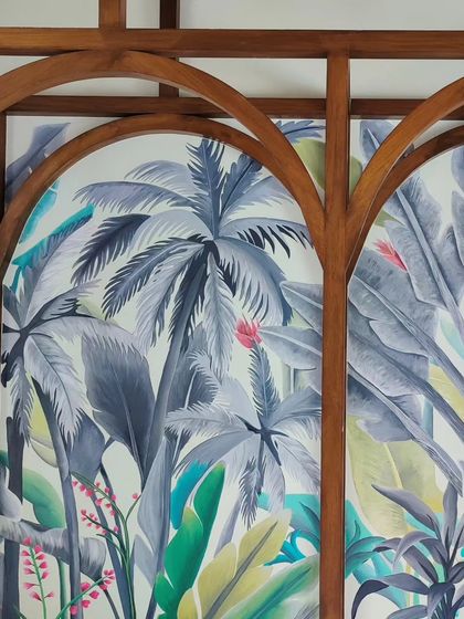 A closer view of the mural through the wooden arches, highlighting the beautiful framing effect.