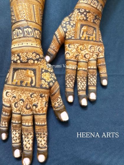 Another view of the elephant-themed back-hand design, showing the full coverage on both hands.