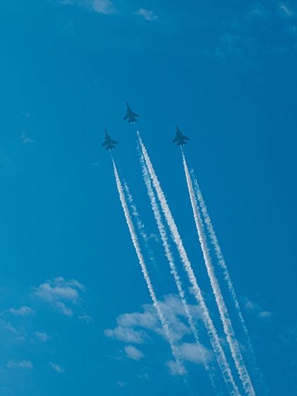 A tight formation of three jets with smoke trails, showcasing the skill of the IAF pilots.