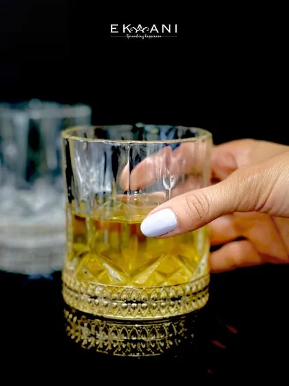 This version of my whiskey glass features a simpler, yet equally elegant, patterned gold base. It is a timeless design for enjoying a fine pour at the end of the day.