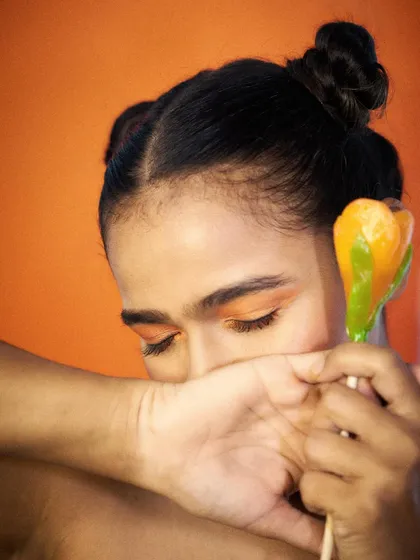 A coy and gentle pose with a candy prop. This shows a softer side of my modeling, suitable for brands looking for a warm and approachable feel.