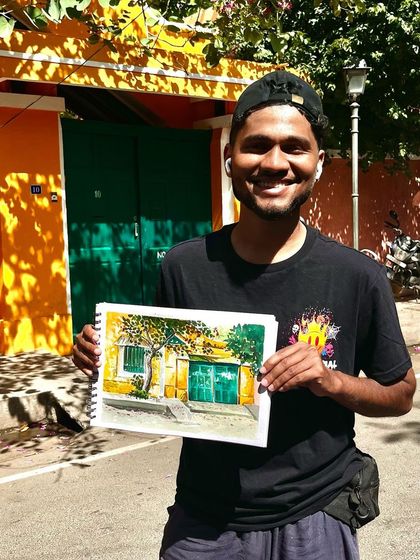 Me, holding my finished painting in White Town, Pondicherry. It's always a great feeling to complete a piece on location.