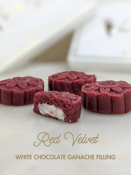 The Red Velvet Xmas Cake Mithai, featuring a classic red velvet flavor and a sweet white chocolate ganache filling.