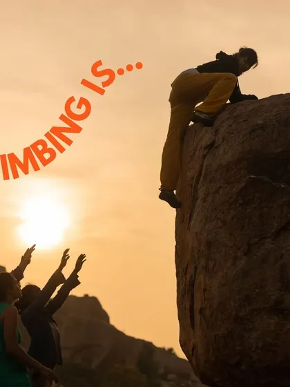 Climbing is... a journey. This image captures the moment a climber reaches the top, supported by her friends below.