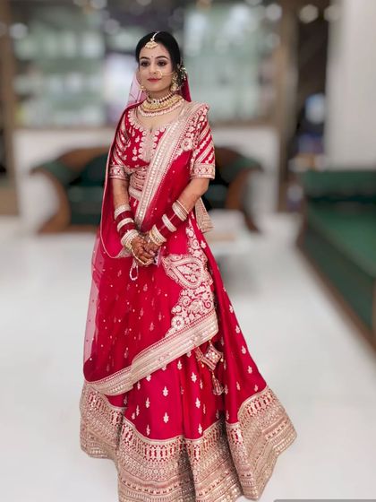 A full-length view showing how the makeup, hair, and outfit come together. The entire look is cohesive and designed for a grand bridal entrance.