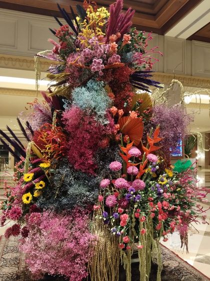 For the festival of Holi, I created this explosion of color to fill the lobby with joy. This arrangement features a vibrant mix of dyed and natural flowers, capturing the exuberant spirit of the celebration. It’s a testament to how life is beautiful when we embrace every shade.