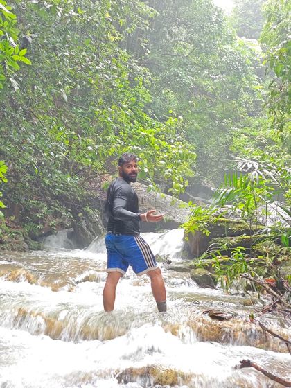 One of our trekkers enjoying the cool, rushing waters of a stream in the Sharavathi Valley. Our treks often involve crossing such beautiful forest streams.