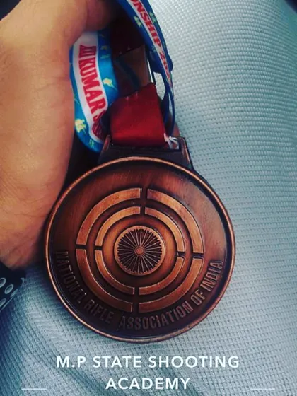 A close up of the bronze medal from the KSS Memorial Shooting Championship, a prestigious national level event.