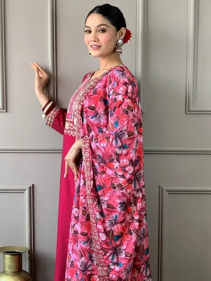 A gorgeous rani pink viscose chanderi kurta with a stunning floral printed dupatta. The heavy embroidery on the neckline makes it perfect for a festive occasion.