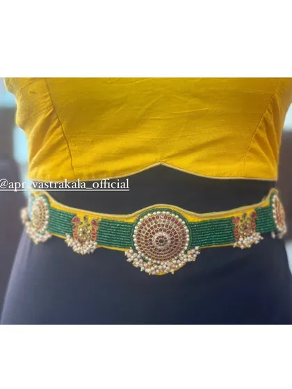 A matching embroidered waist belt, worn here to showcase how our accessories complete the look.