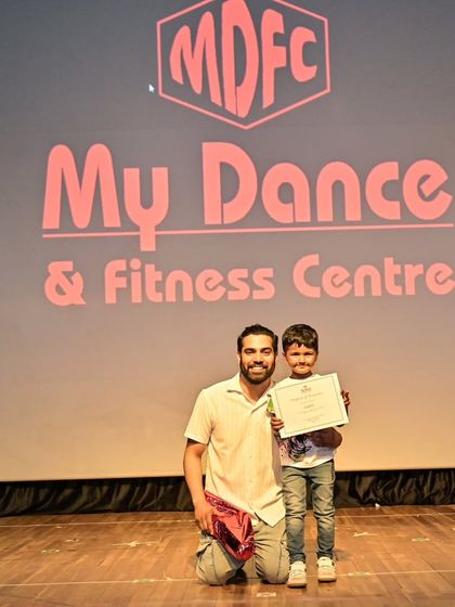 A happy moment with Aadil after his performance, certificate in hand. These moments are what make our journey so special.