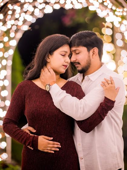 An intimate moment captured within the glowing archway, showcasing the romantic potential of our night-time setups.