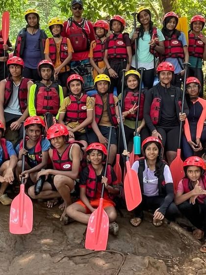 A group photo of our young adventurers at the Dandeli rafting and kayaking course, fully equipped and ready for the river.